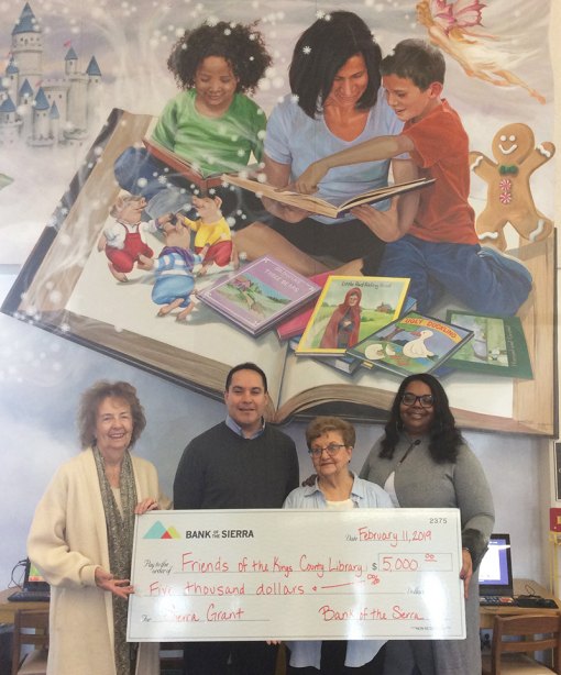 Friends of the Kings County Library received a grant from Bank of the Sierra. Sierra's Mark Ulibarri presents check to Carol Dias, Wilma Humason, Natalie Rencher, Kings Library director.